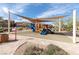 Community playground featuring modern play equipment, landscaping, and shade canopies at 937 Spiracle Ave, Henderson, NV 89002