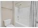 Well-lit bathroom featuring a white shower-tub combo with a shower caddy and curtain at 9413 Aggie Ct, Las Vegas, NV 89148