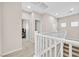 Upper hallway with carpet flooring and white railing at 9413 Aggie Ct, Las Vegas, NV 89148