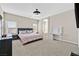 Spacious main bedroom with a ceiling fan, a desk, and views from the window at 9413 Aggie Ct, Las Vegas, NV 89148