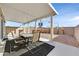 Covered patio area with outdoor seating, ideal for enjoying the fresh air and sunshine at 9413 Aggie Ct, Las Vegas, NV 89148