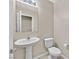 Compact powder room with modern sink and toilet at 9413 Aggie Ct, Las Vegas, NV 89148