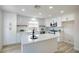 Modern kitchen featuring white cabinets, an island, stainless steel appliances, and beautiful countertops at 9882 Pioneer Ave, Las Vegas, NV 89117