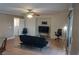 Cozy living room features neutral walls, ceiling fan, and tile floors at 10228 W Crepe Myrtle Ct, Las Vegas, NV 89183