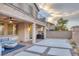 Scenic backyard with a covered patio, pavers, gravel and a built in firepit at 12382 Piazzo St, Las Vegas, NV 89141