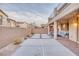 An outdoor patio area with a built-in seating area, hardscape, and block wall provides a relaxing atmosphere at 12382 Piazzo St, Las Vegas, NV 89141