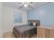Cozy bedroom with a comfortable bed, neutral decor, and ample natural light at 12382 Piazzo St, Las Vegas, NV 89141