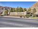 Attractive Southern Highlands community entrance sign with mature landscaping and the mountains behind at 12382 Piazzo St, Las Vegas, NV 89141