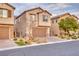 Charming two-story home with desert landscaping and an attached two-car garage at 12382 Piazzo St, Las Vegas, NV 89141