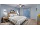 Serene main bedroom with sliding glass door, neutral decor, and a ceiling fan at 12382 Piazzo St, Las Vegas, NV 89141