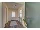 Bright entryway with a modern console table, wood floors and stylish decor at 1631 Desert Path Ave, North Las Vegas, NV 89032