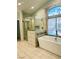 Bathroom with a white tub next to shower and views of the pool area at 1705 Pink Cliff Ct, Las Vegas, NV 89128