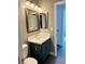 Cozy bathroom featuring modern vanity with sink, framed mirror, and neutral-colored walls at 1705 Pink Cliff Ct, Las Vegas, NV 89128