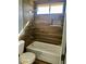 Bathroom featuring a tub, shower, and wood accent wall at 1705 Pink Cliff Ct, Las Vegas, NV 89128