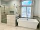 Bathroom with a white tub next to shower at 1705 Pink Cliff Ct, Las Vegas, NV 89128