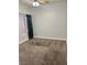 Bedroom featuring neutral carpet, window with blinds, and ample natural light at 1705 Pink Cliff Ct, Las Vegas, NV 89128