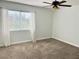 Bedroom with neutral carpet, ceiling fan, and large window at 1705 Pink Cliff Ct, Las Vegas, NV 89128