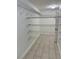 Walk-in closet featuring wire shelving and tiled floors at 1705 Pink Cliff Ct, Las Vegas, NV 89128