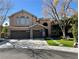 Charming two-story home featuring a three-car garage and stone accents at 1705 Pink Cliff Ct, Las Vegas, NV 89128