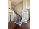 Grand foyer with curved staircase, high ceilings, and hardwood floors at 1705 Pink Cliff Ct, Las Vegas, NV 89128