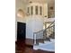 Grand foyer with soaring ceilings, dark wood floors, and stylish lighting fixtures at 1705 Pink Cliff Ct, Las Vegas, NV 89128