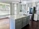 Stylish kitchen island with granite countertop, sink, and modern fixtures at 1705 Pink Cliff Ct, Las Vegas, NV 89128