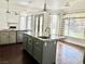 Large kitchen featuring granite countertops, island with sink, and stainless steel appliances at 1705 Pink Cliff Ct, Las Vegas, NV 89128