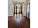 Elegant formal living room with soaring ceilings, columns, and hardwood floors at 1705 Pink Cliff Ct, Las Vegas, NV 89128
