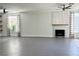 Spacious living room boasts gray tile floors, a modern fireplace, and lots of natural light from the windows at 1705 Pink Cliff Ct, Las Vegas, NV 89128