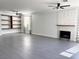Bright living room with grey tile floors, a modern fireplace, and open shelving at 1705 Pink Cliff Ct, Las Vegas, NV 89128