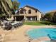 Backyard with a large pool, spa, built in BBQ and covered patio at 1705 Pink Cliff Ct, Las Vegas, NV 89128