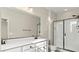 Contemporary bathroom boasting a large mirror, dual sink vanity, and glass shower at 1803 Potosi Peak Ave, North Las Vegas, NV 89031
