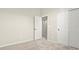 Carpeted bedroom with an opened door and double sliding closet at 1803 Potosi Peak Ave, North Las Vegas, NV 89031