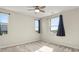 Inviting bedroom with neutral carpet, multiple windows and fan at 1803 Potosi Peak Ave, North Las Vegas, NV 89031