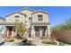 Charming townhome features a well manicured front yard with decorative stone and fresh landscaping at 1803 Potosi Peak Ave, North Las Vegas, NV 89031