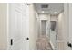 Hallway view with white doors, carpet and staircase at 1803 Potosi Peak Ave, North Las Vegas, NV 89031