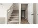 Carpeted staircase leading to an upper level, with a storage area under the stairs at 1803 Potosi Peak Ave, North Las Vegas, NV 89031