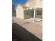 Backyard area with an outdoor seating area and dirt at 1805 Monte Alban Dr, North Las Vegas, NV 89031