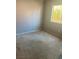Bedroom with a large window, carpet, and electrical outlet at 1805 Monte Alban Dr, North Las Vegas, NV 89031