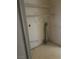 Neutral utility closet featuring wire shelving for storage and hookups at 1805 Monte Alban Dr, North Las Vegas, NV 89031