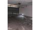 A two-car garage featuring a garage door and concrete flooring at 1805 Monte Alban Dr, North Las Vegas, NV 89031