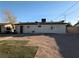 Backyard with a gravel area and small patches of grass at 1912 W Carey Ave, North Las Vegas, NV 89032