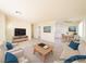 Open living room showing the dining area, light colored furniture, and neutral walls at 1912 W Carey Ave, North Las Vegas, NV 89032