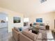 Bright living room featuring neutral furniture, stylish decor, and tile flooring at 1912 W Carey Ave, North Las Vegas, NV 89032