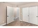 Bedroom with closet and hallway access features wood-style flooring at 2110 Sleepy Ct, Las Vegas, NV 89106