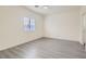 Clean bedroom featuring gray floors, neutral walls, and natural light from the window at 2132 Fred Brown Dr, Las Vegas, NV 89106