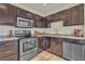 Modern kitchen with stainless steel appliances and dark wood cabinets at 239 N Bruce St, Las Vegas, NV 89101