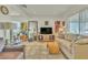 Bright living room featuring tile floors, neutral walls, a comfortable sofa, and stylish furnishings at 239 N Bruce St, Las Vegas, NV 89101