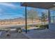 Covered front porch with sleek modern design and views of the surrounding desert landscape at 2494 Veronella St, Henderson, NV 89044