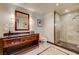 Modern bathroom boasts granite countertops, wood cabinets, and a stand-up glass shower at 2700 Las Vegas Blvd # 4109, Las Vegas, NV 89109